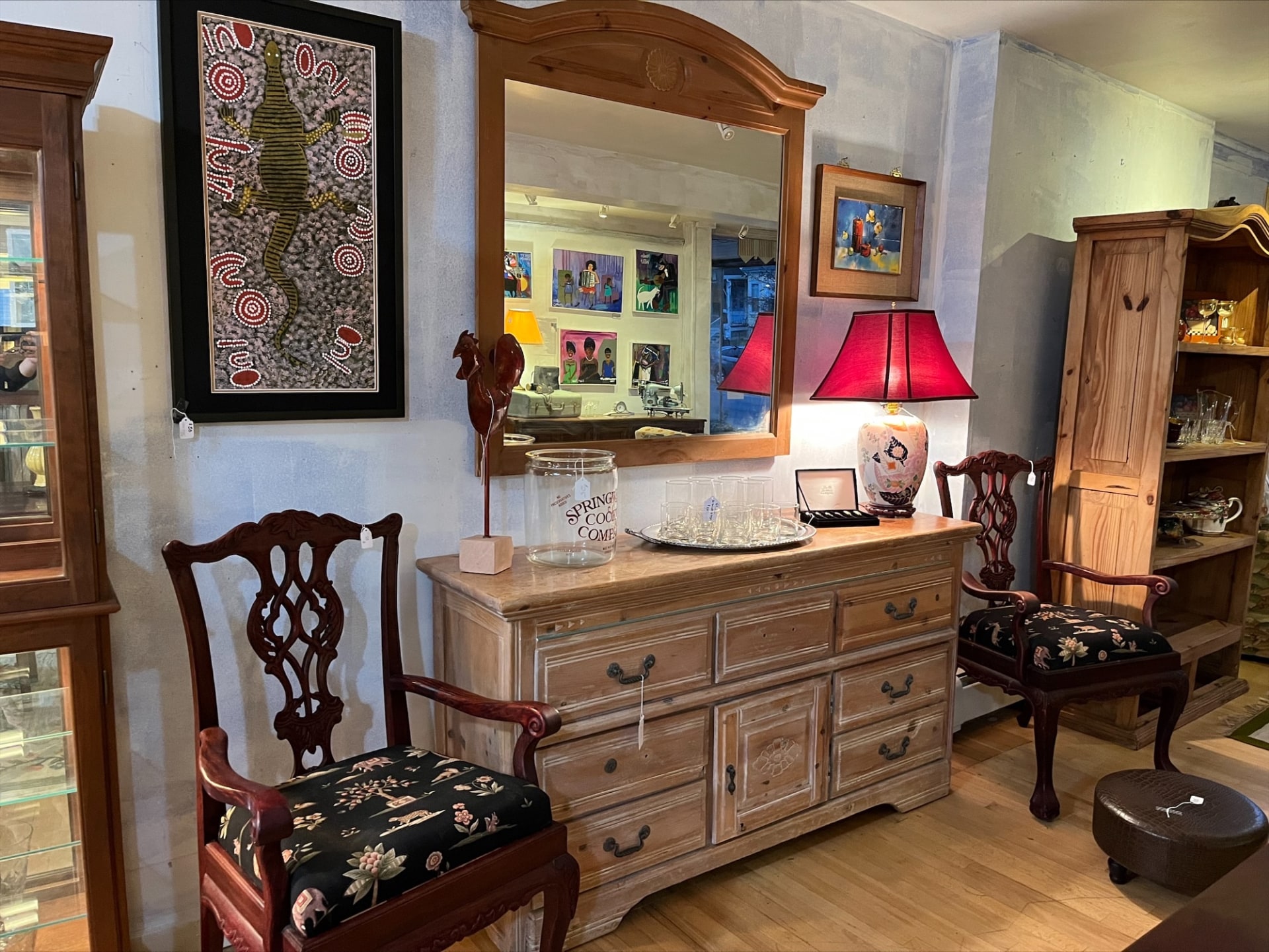 a dresser and chair in a room