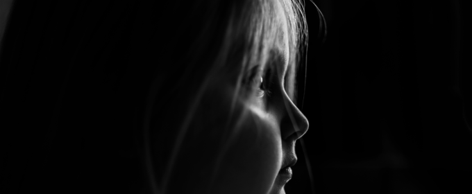 a black and white photo of a young girl