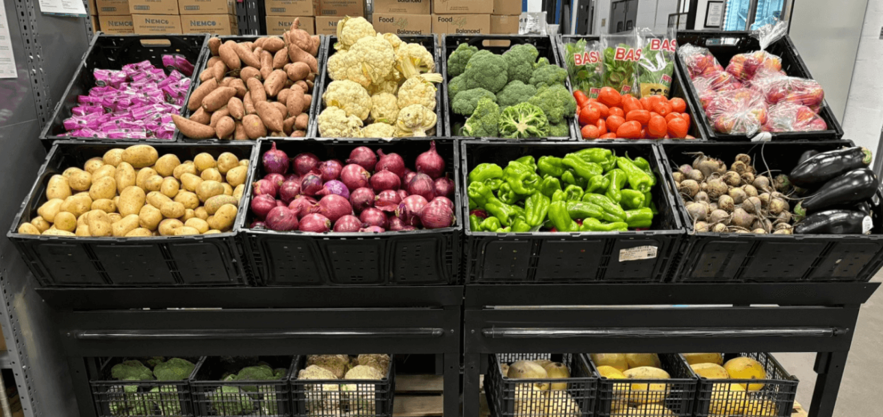 a group of vegetables in bins