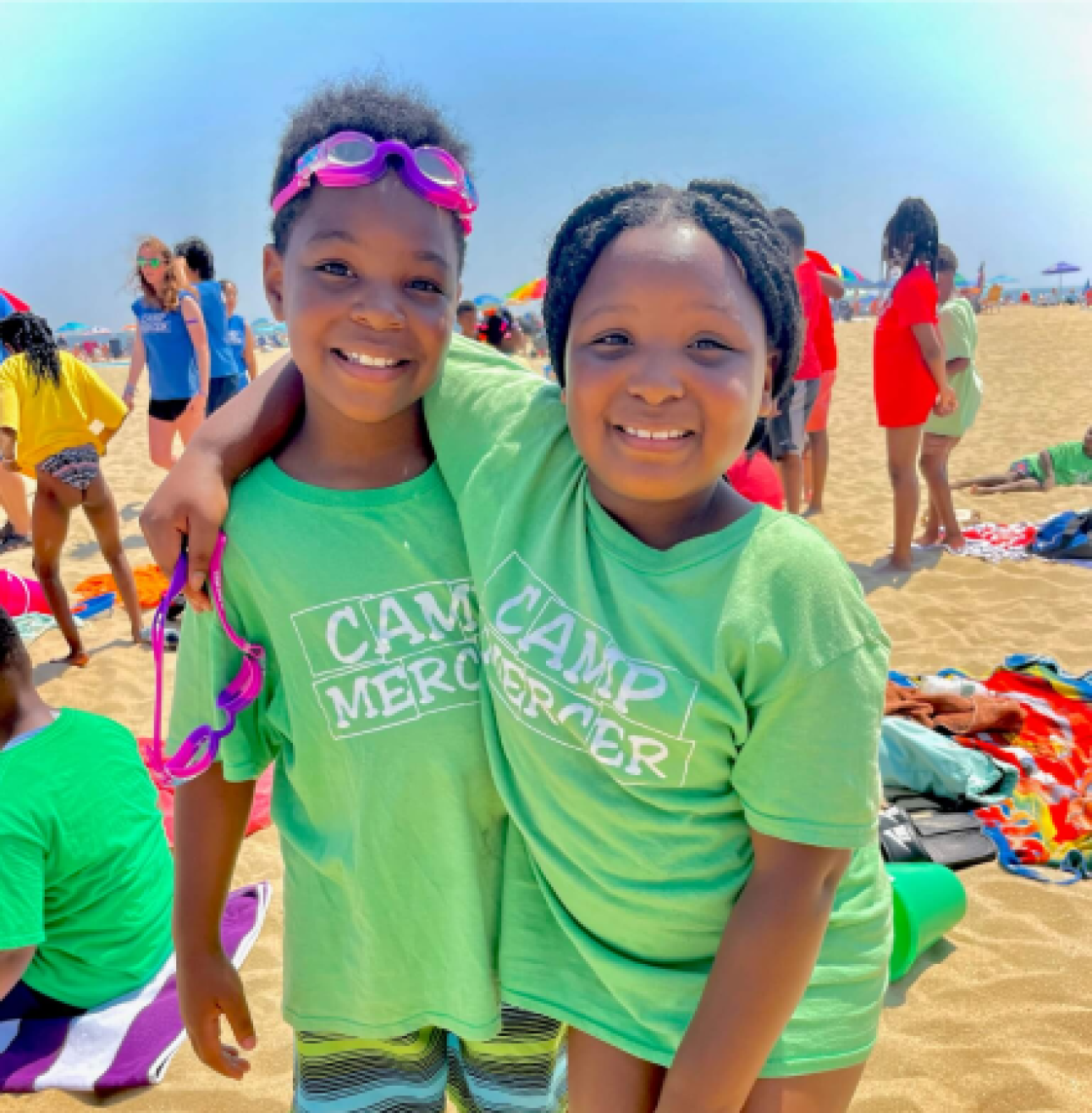 two childs standing on a beach