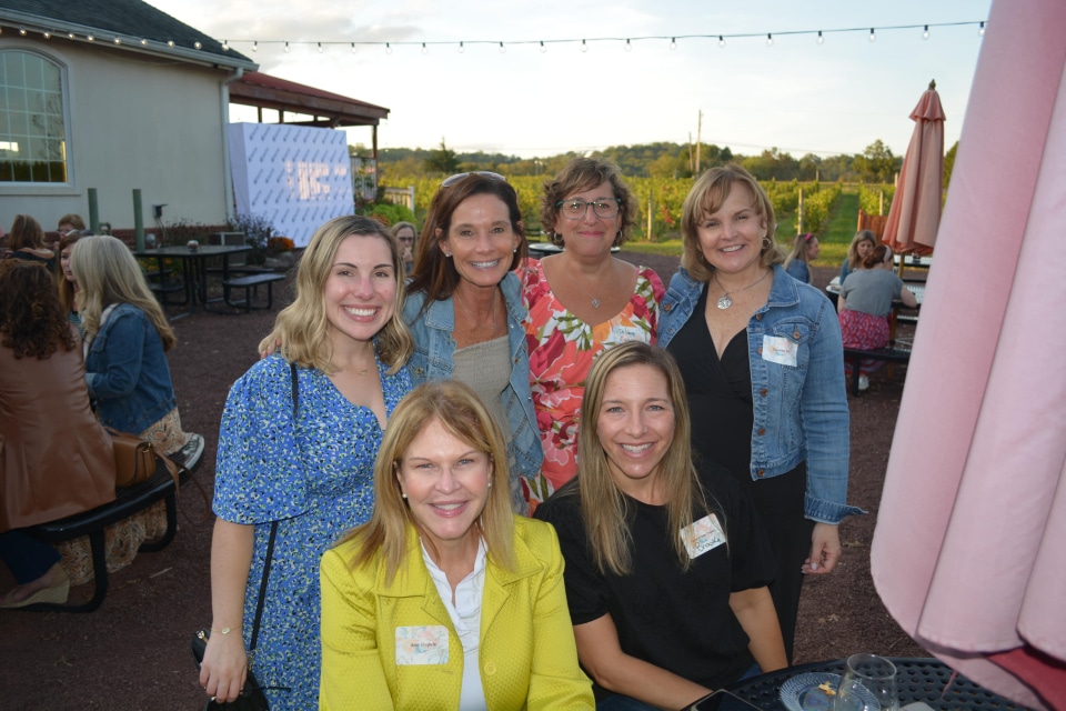 a group of women posing for a photo